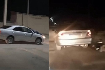 в казахстане водитель провез двух полицейских на капоте автомобиля (видео)